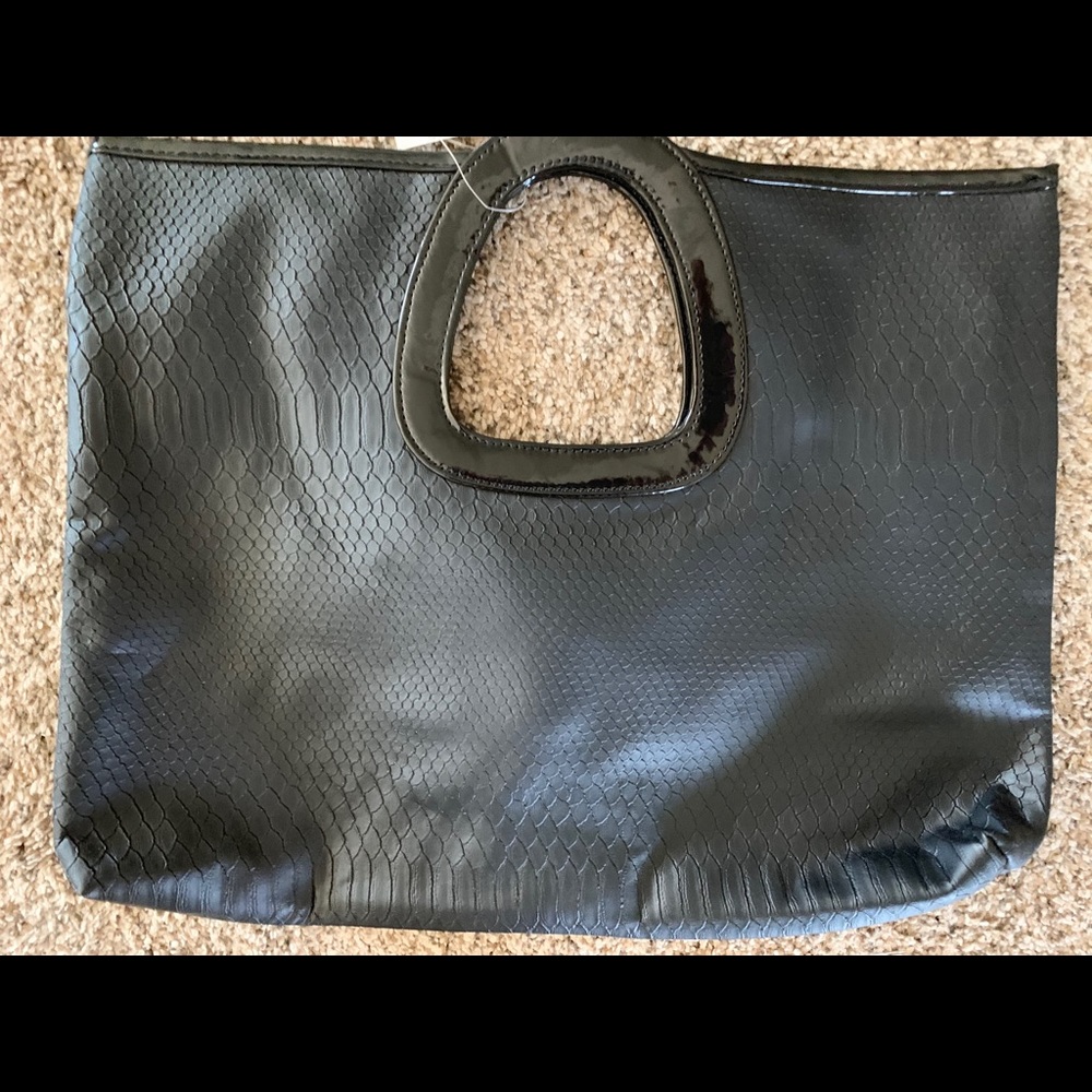 Super cute black clutch.  BNWT